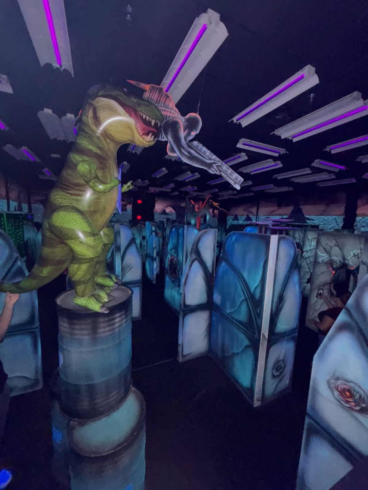 Tye the T-Rex in the original black-light arena